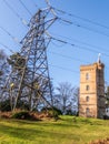 Painshill Park, Cobham Surrey, England. February 11 2020 Gothic tower and electricity pylon.