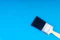 Paint brush on blue colour background Royalty Free Stock Photo