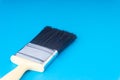Paint brush on blue colour background Royalty Free Stock Photo
