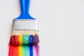 Paint brush closeup and multicolor rainbow brush strokes Royalty Free Stock Photo