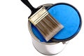 Paint brush and lid on a can of blue paint Royalty Free Stock Photo