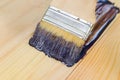 Paint brush with oil paint on wood Royalty Free Stock Photo