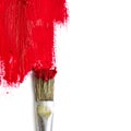 Paint brush paints the white surface with red color, concept rep