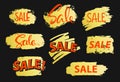 Paint brush strokes sale banners in golden gradient on black Royalty Free Stock Photo