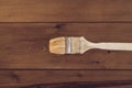 Paint brush on a wooden background