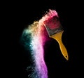 paint brushes with abstract powder color explosion isolated on b