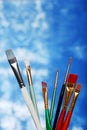 Paint brushes on a blue and white background