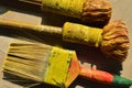 Paint brushes for home painting. Color swatch used to match paint. Abstract background