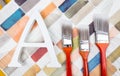 Paint brushes and letter A on watercolor background Royalty Free Stock Photo