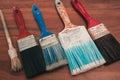 Paint brushes on the old wooden background Royalty Free Stock Photo