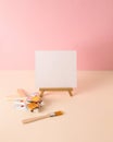 Paint brushes, paint tubes and canvas on pastel background. Minimal concept. Copy space Royalty Free Stock Photo