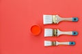 Paint can and brush on orange background. House renovation concept. Set of tools and paints for making repair in flat Royalty Free Stock Photo