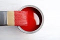 Paint can and brush on wooden background Royalty Free Stock Photo