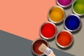 Paint cans and brush on pastel color background. copy space Royalty Free Stock Photo