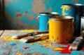 Paint cans and brushes with colorful splashes on a rustic wooden surface, ready for artistic creation or renovation projects Royalty Free Stock Photo