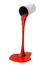 Paint for coloring is poured from can isolated Royalty Free Stock Photo