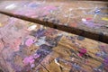 Paint daubs on arts and crafts table Royalty Free Stock Photo