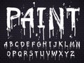 Paint dripping paint font for latin alphabet isolated on dark background with bricks. White oil letters Royalty Free Stock Photo