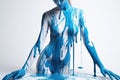 paint drips from the woman body, blue liquid drops on beautiful model girl`s body, creative abstract