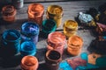 paint jars on a wooden surface