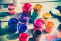 paint jars on a wooden surface