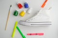 Paint, markers, brush and sneaker Royalty Free Stock Photo