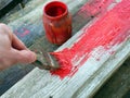 Old brushes in the paint process of painting an old board