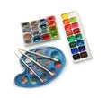 Paint palette and watercolors with brushes on white background Royalty Free Stock Photo