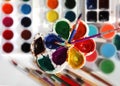 Paint palettes and brushes. Selective focus