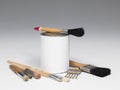 Paint pot and set of paintbrushes Royalty Free Stock Photo