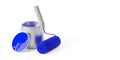 Paint roller with blue paint leaning against single silver paint can with blue paint over white background, home improvement, Royalty Free Stock Photo