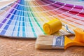 Paint roller brush and pantone color palette guide Royalty Free Stock Photo