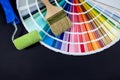 Paint roller and brushes with color swatch book Royalty Free Stock Photo