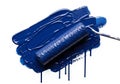 Paint roller covered in a rich, glossy blue paint, applied on a white surface. The roller leaves a Royalty Free Stock Photo