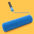 Paint roller for painting walls and renovating apartment on yellow background.