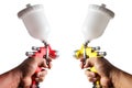 Paint spray of the painter`s arm hand holding industrial size spray gun used for industrial painting and coating and  on Royalty Free Stock Photo