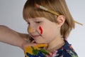 A paint stained sad but very beautiful little girl Royalty Free Stock Photo