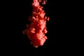 Paint stream in water, colored ink cloud, abstract background, process of liquefaction red dye on a black background Royalty Free Stock Photo
