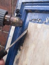 Paint stripping kitchen cupboards Royalty Free Stock Photo