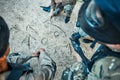 Paintball, battlefield and team building with game plan, mission and strategy drawing in sand with soldier group. War Royalty Free Stock Photo