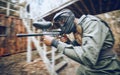 Paintball, black man and games, gun and target, sport with fitness and battlefield challenge, war soldier outdoor Royalty Free Stock Photo