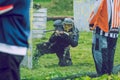 Paintball game battle, players and guns. Latvia, Cesis. 2012