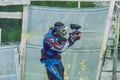 Paintball game battle, players and guns. Latvia, Cesis. 2012