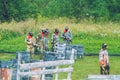 Paintball game battle, players and guns. Latvia, Cesis. 2012