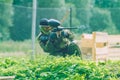 Paintball game battle, players and guns. Latvia, Cesis. 2012