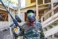 Paintball player got paint headshot during siege of fortress. Royalty Free Stock Photo