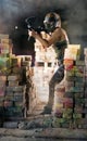 Paintball player with gun in action Royalty Free Stock Photo