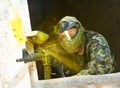 Paintball player under attack Royalty Free Stock Photo