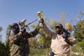 Paintball players with gold cup