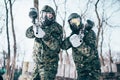 Paintball players in splattered masks after battle Royalty Free Stock Photo